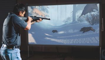 Hunters Education using Laser Shot Simulations software called Full Boar on a 9 feet screen size, Simulated firearm standard rifle